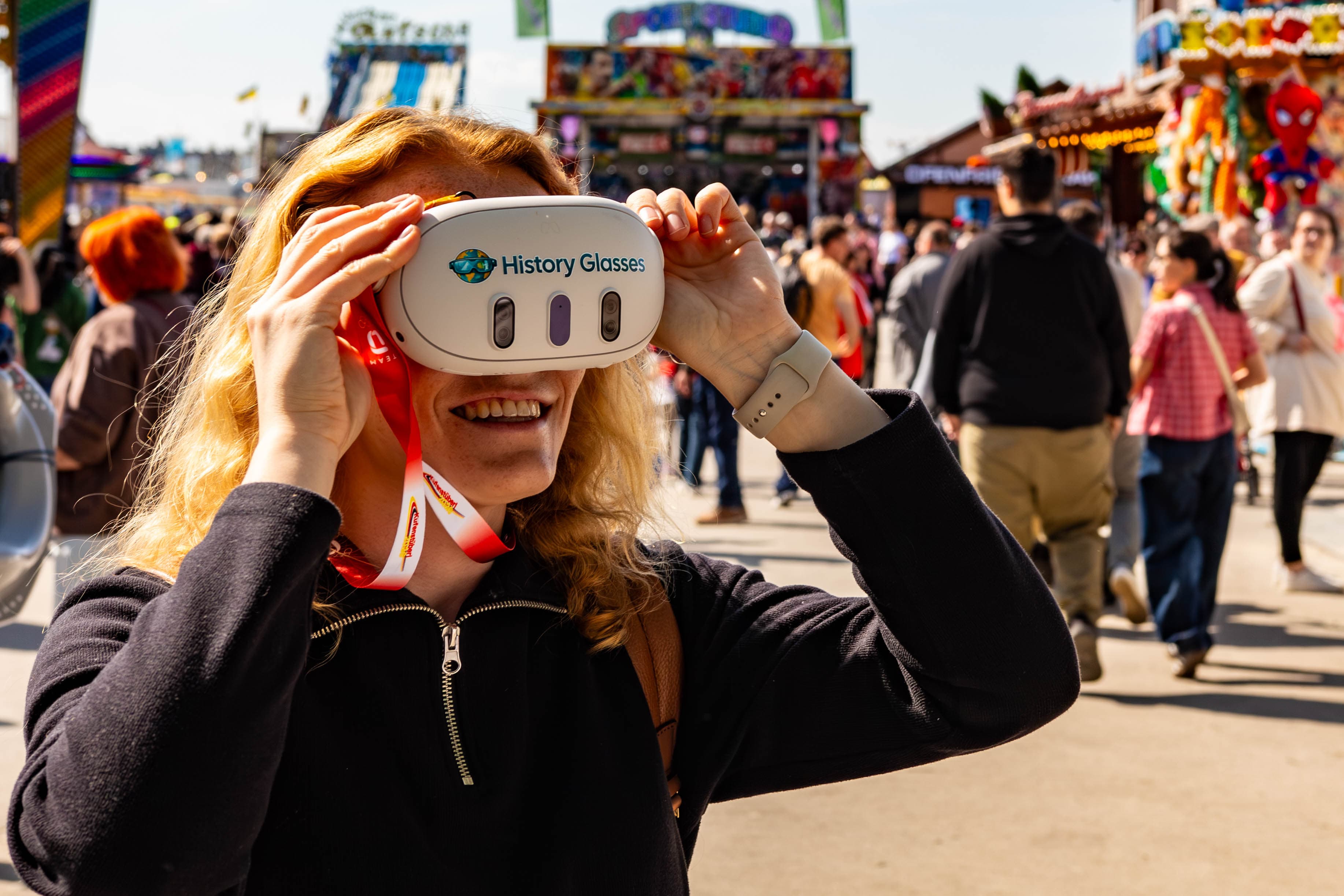 Guest at a festival looking through See Reality History Glasses