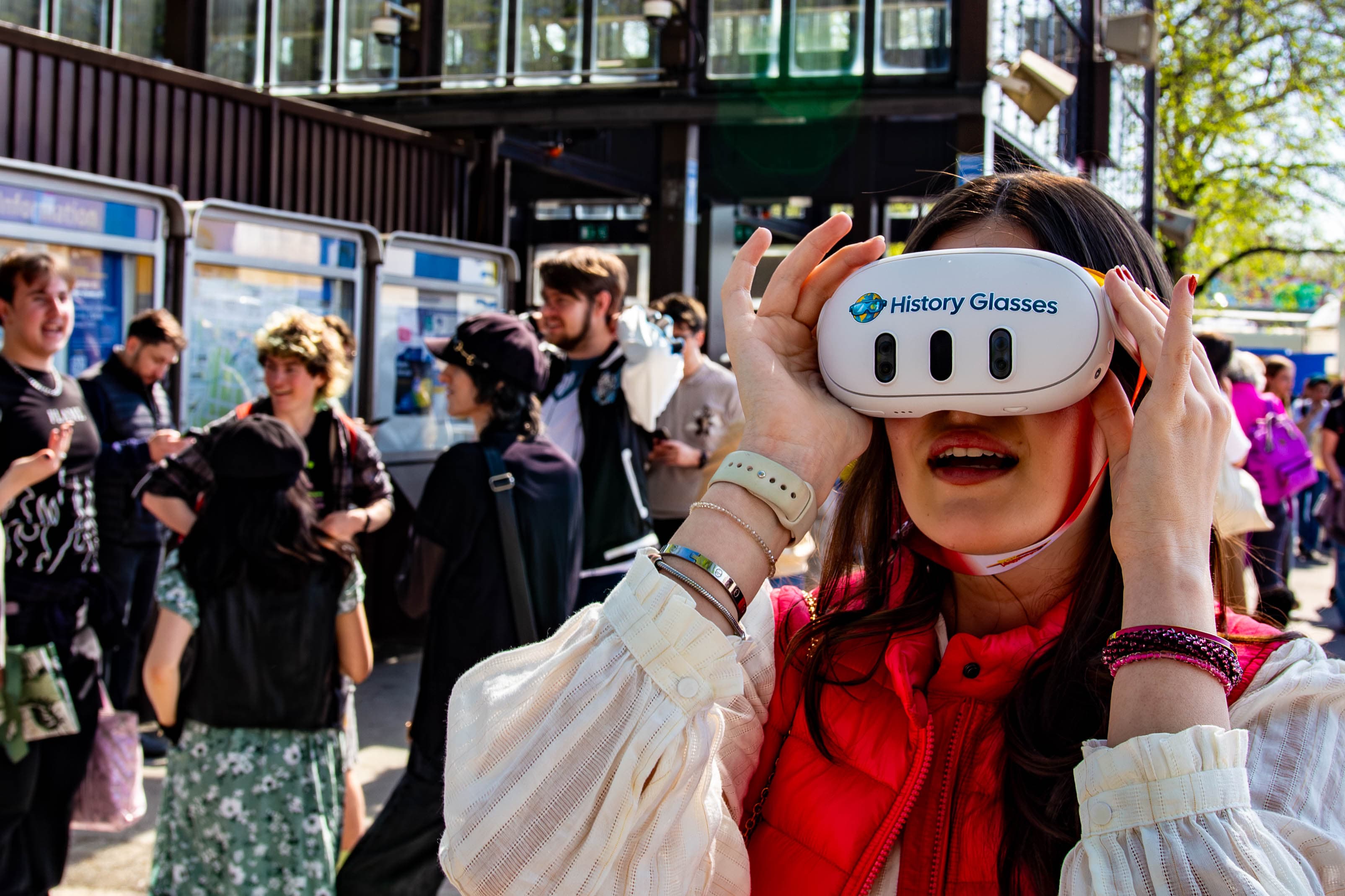 Guest holding History Glasses up to look through the lenses